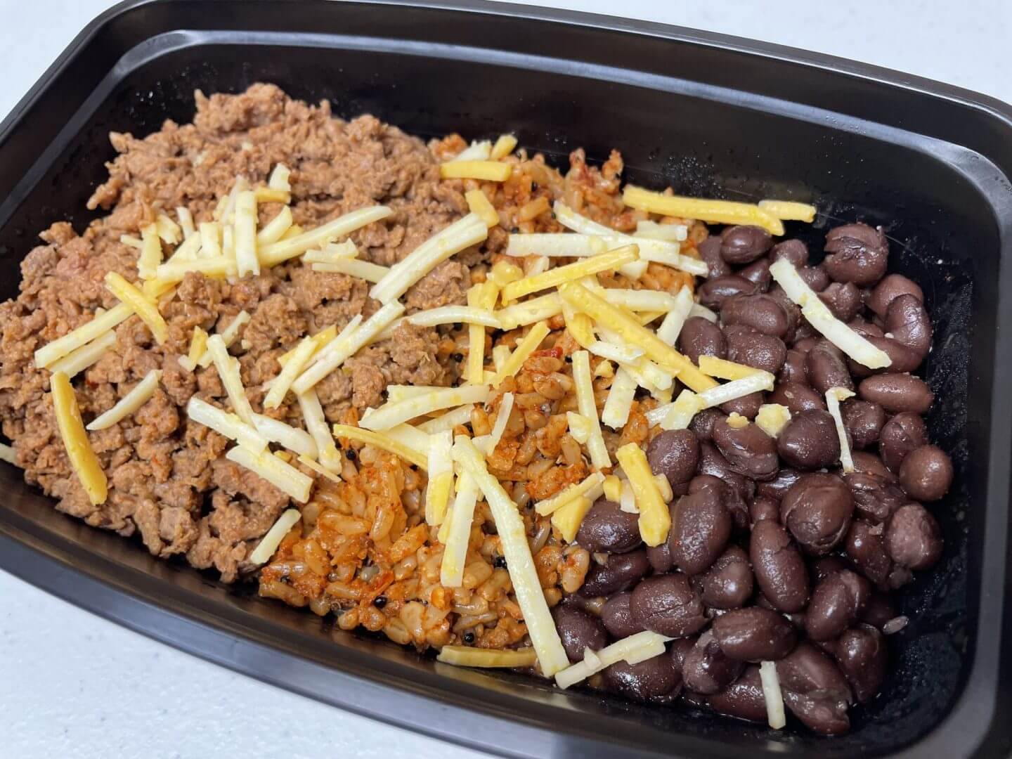 http://nuhealthkitchen.com/cdn/shop/products/BeyondTacoBowlwithSeasonedBlackBeansandSpanishRice_Vegan-sw.jpg?v=1668707365